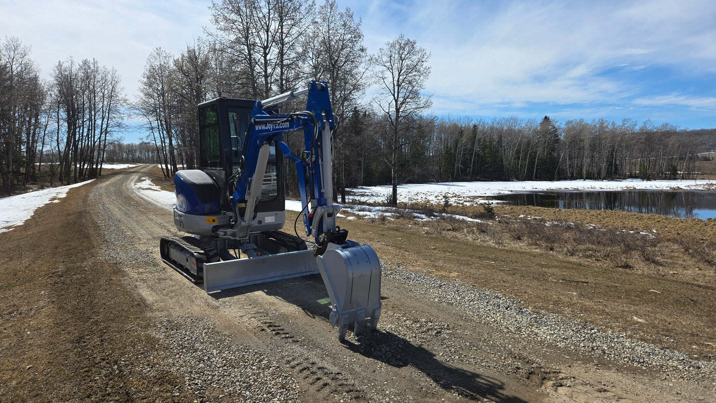 JT5350 3.5 ton mini excavator with Kubota engine working on rural gravel road near pond Canada compact excavator for construction and landscaping projects