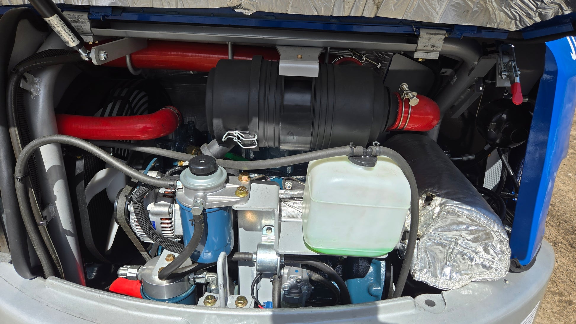 JT5350 3.5 ton mini excavator Kubota engine compartment showing air filter coolant tank and hydraulic components Canada compact excavator for construction use

