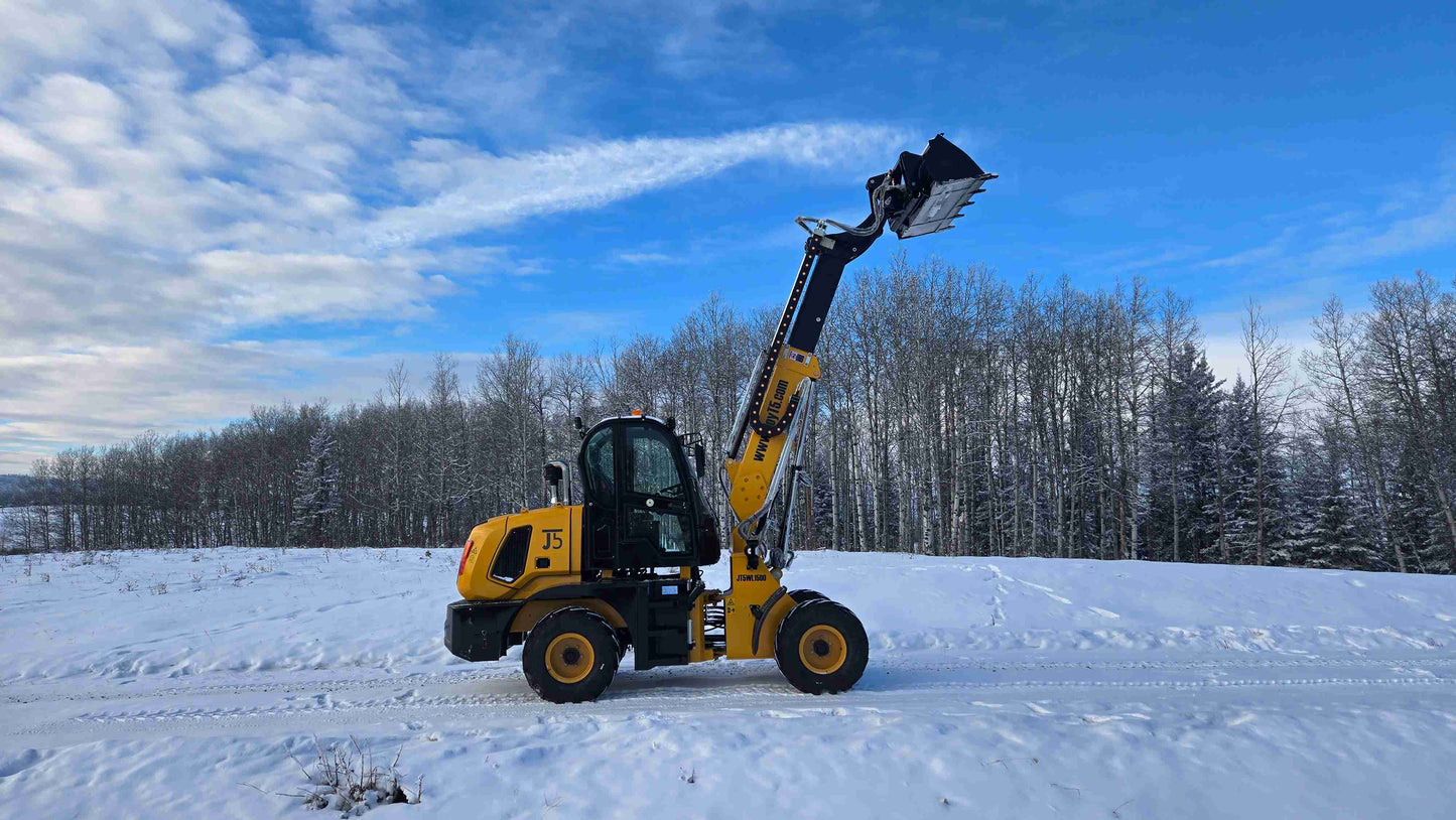 JT5WL1500 compact wheel loader full side profile with extended boom and bucket in outdoor snowy field.