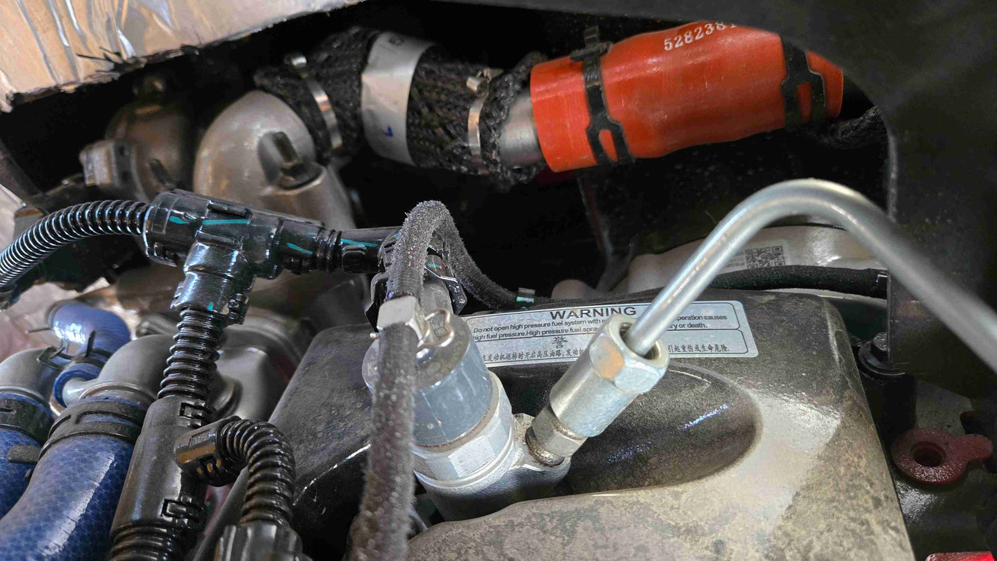 High pressure fuel system warning label on the JT5WL1500 wheel loader engine compartment.
