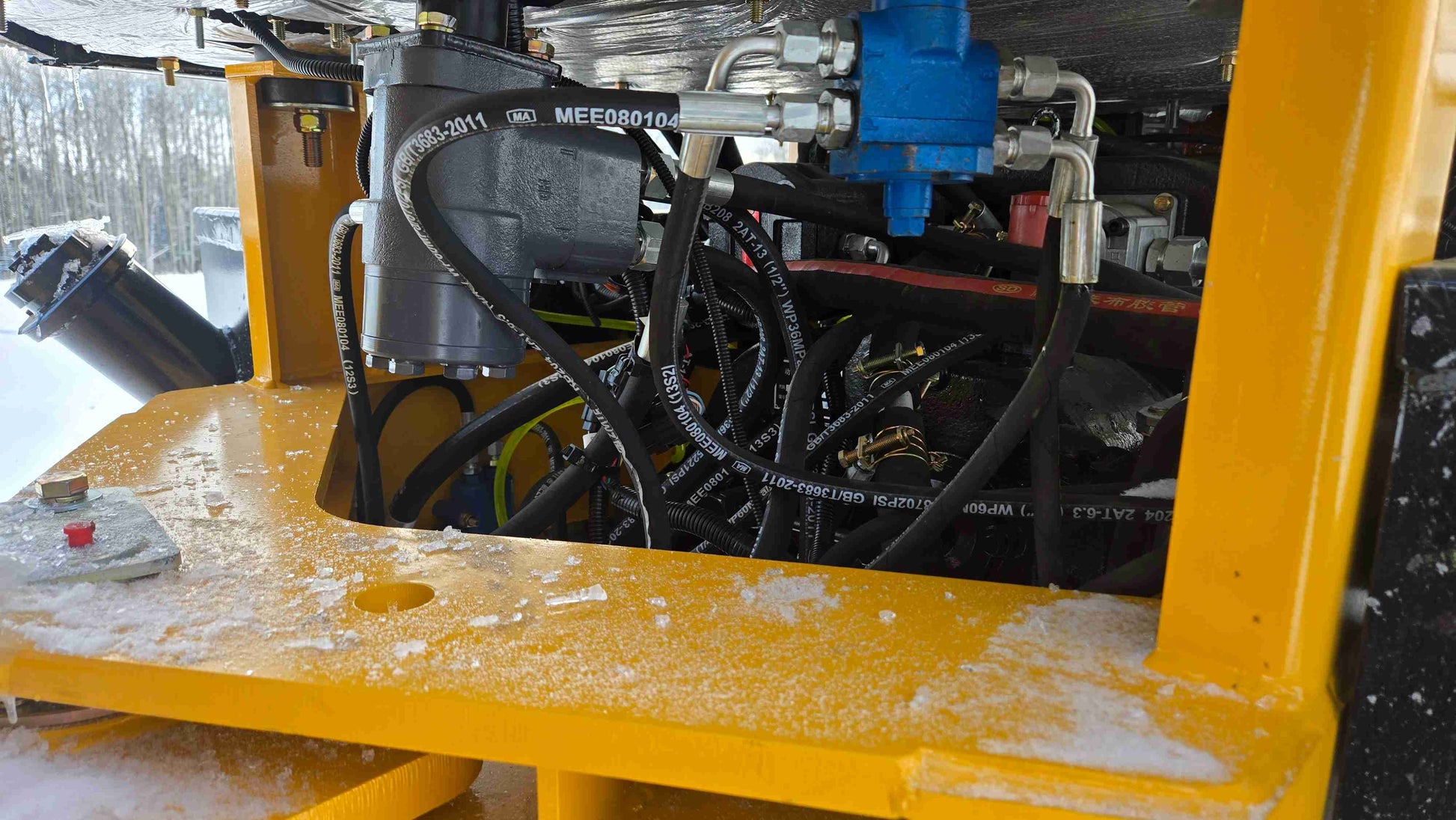 Close-up view of hydraulic valve and hose system in JT5WL1500 wheel loader ensuring powerful and reliable performance.