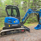 Rippa R32 Mini Excavator with hydraulic system parked in Canada forest, compact excavator for landscaping and construction