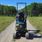 Rippa R13 mini excavator for sale by JoyT5 on a gravel path with trees and open sky in the background