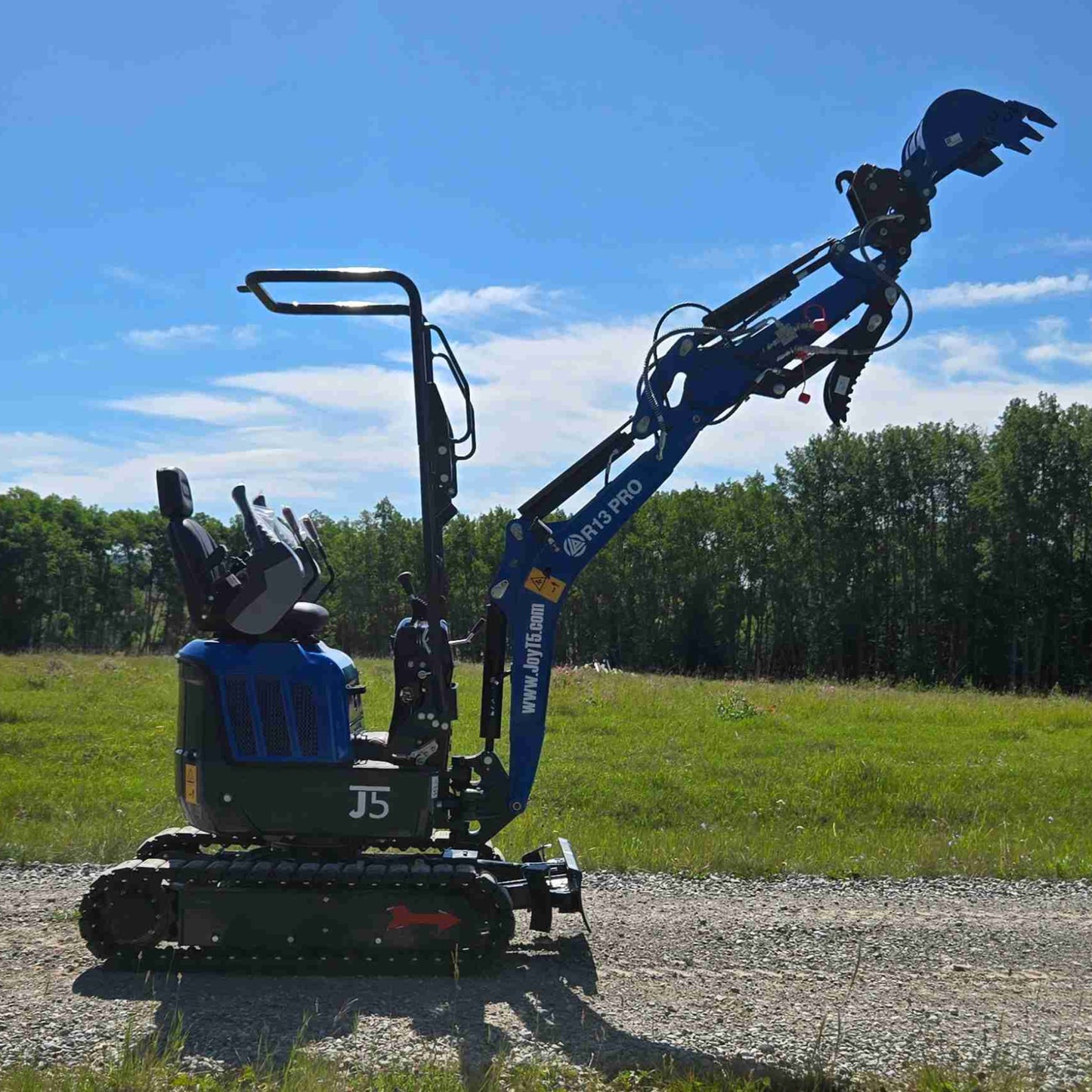 Rippa R13 Excavator for sale on a gravel path with trees and blue sky in the background