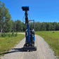 Rippa R13 mini excavator for sale by JoyT5 on a gravel path with trees and clear sky in the background