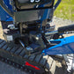 Side swing boom closeup of Rippa R13 mini excavator for sale by JoyT5 on a gravel surface with grass in the background