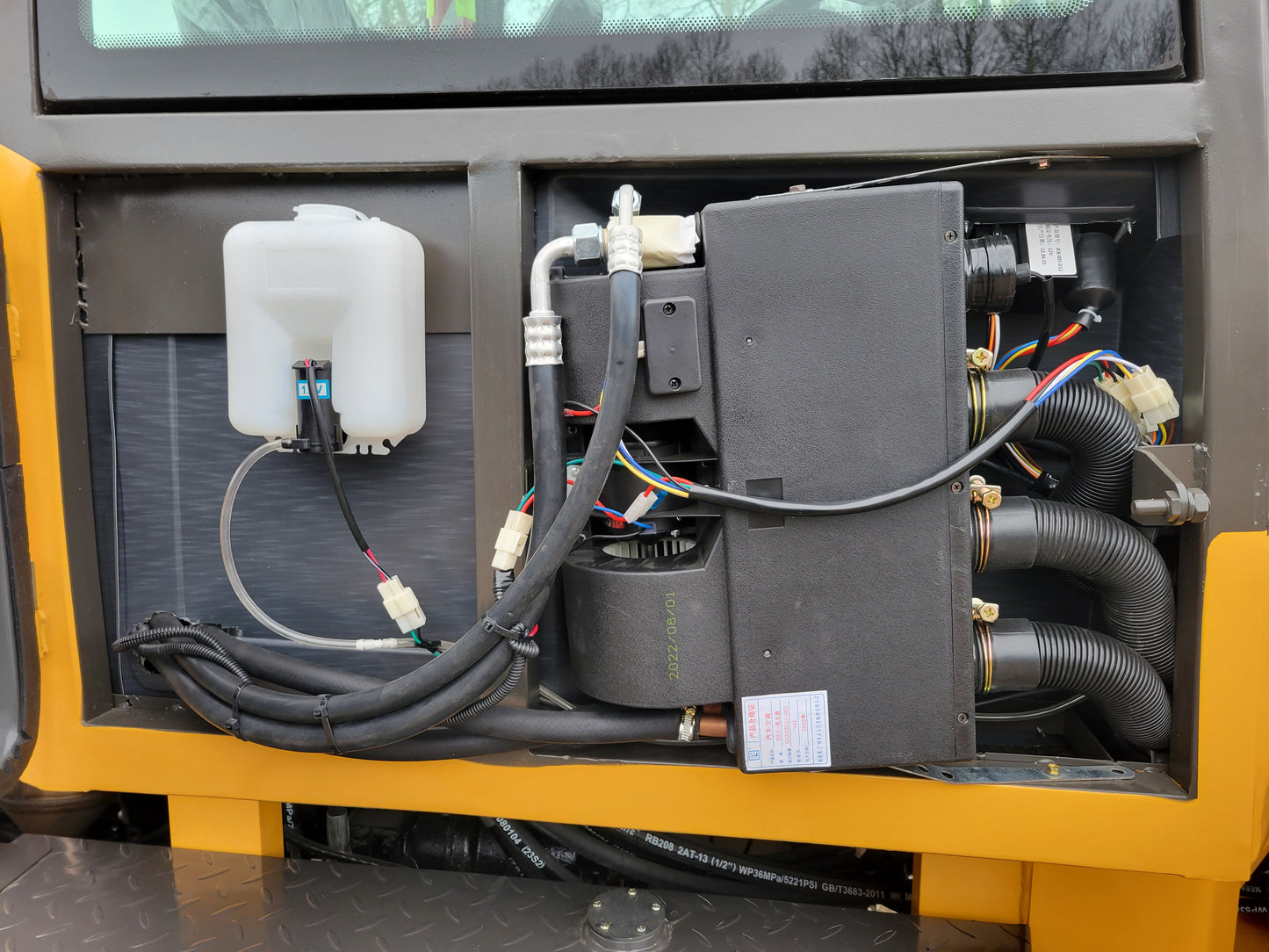 JT5WL1200 Compact Wheel Loader 1.2 Ton for Sale in Canada showing cabin heating and electrical wiring system designed for comfort and efficient snow removal operations