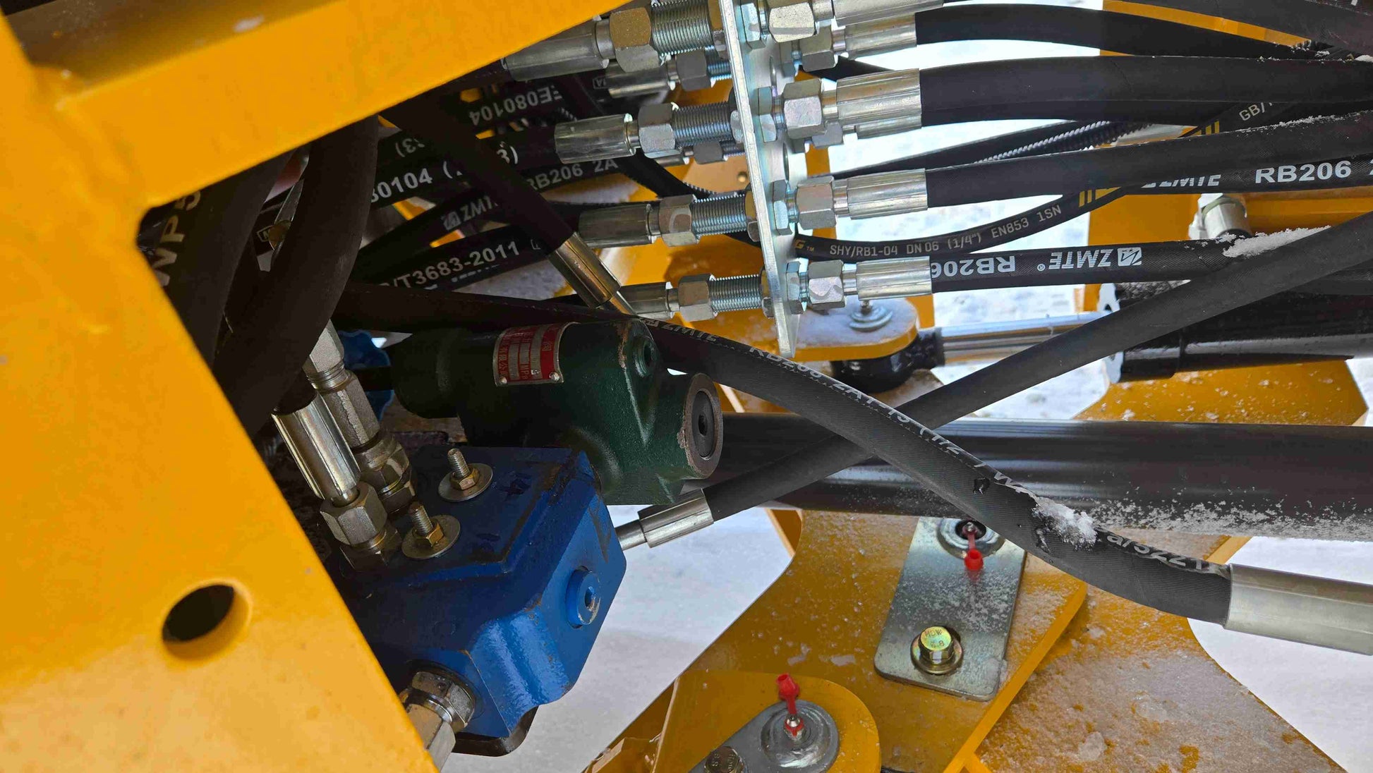 Compact Wheel Loader JT5WL1500 1.5 Ton for Sale in Canada close up of hydraulic valve and hose connections designed for reliable snow removal and construction operations