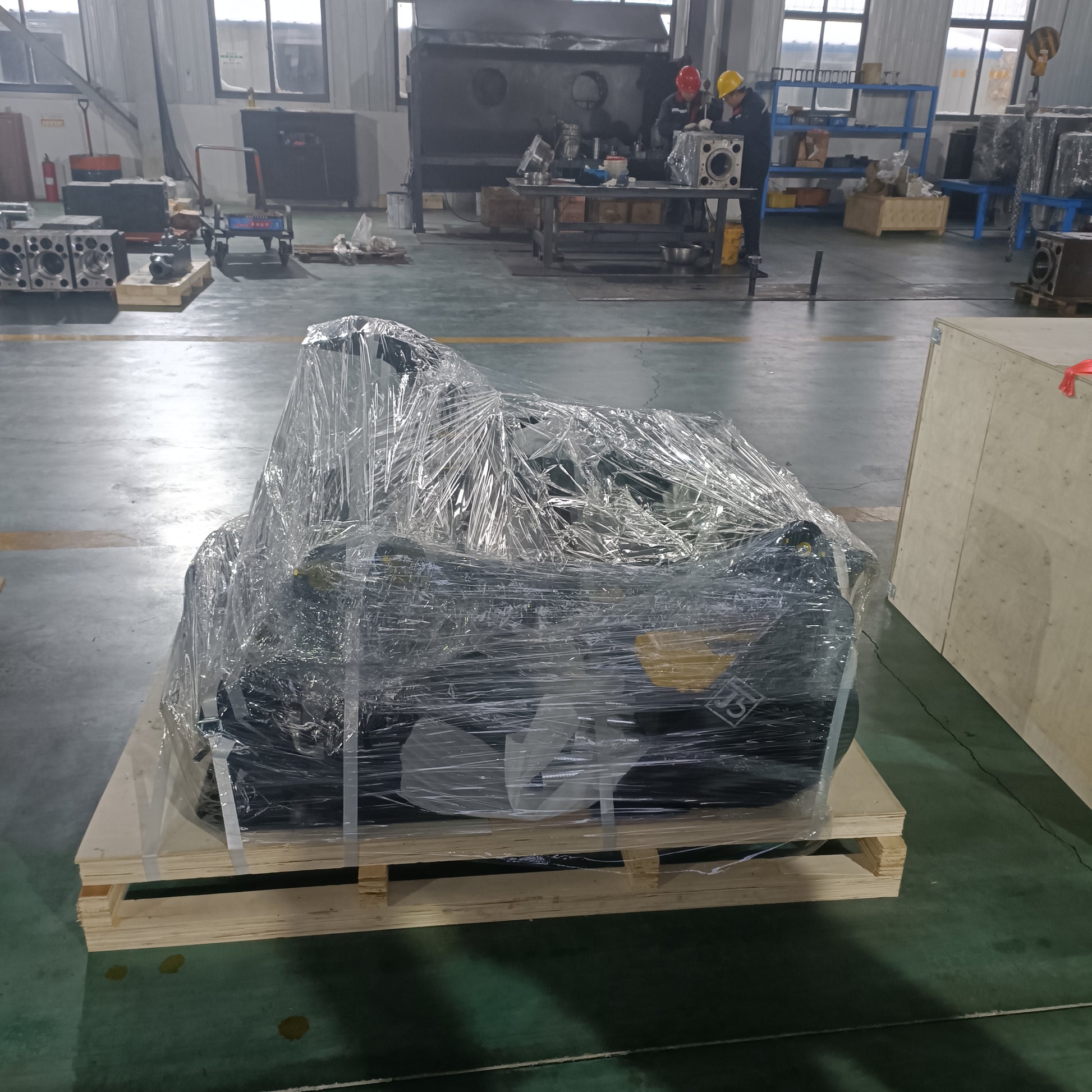 custom excavator attachments made in Canada securely packaged for shipping including heavy duty bucket and grapple for construction equipment