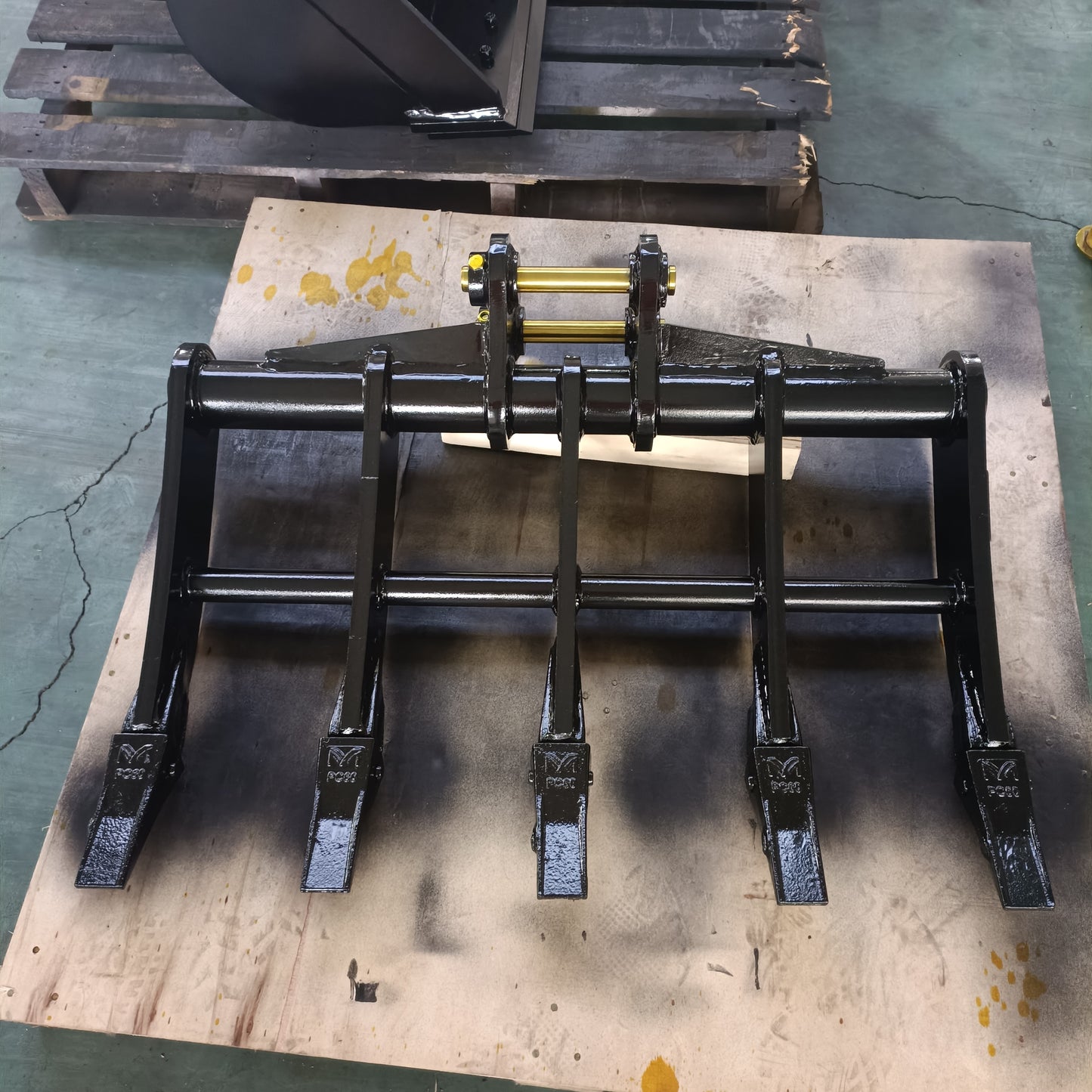 custom excavator rake attachment made in Canada heavy duty ground clearing and land preparation tool for construction and landscaping use