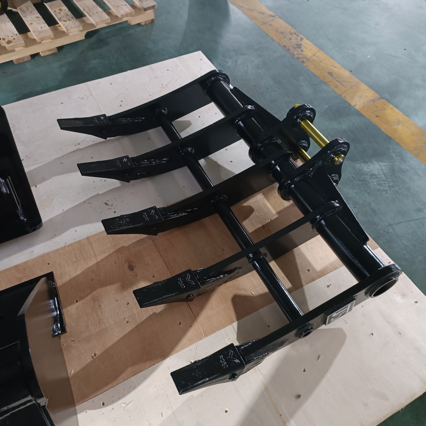 custom excavator rake attachment made in Canada heavy duty tool for root clearing land preparation and debris removal in construction projects

