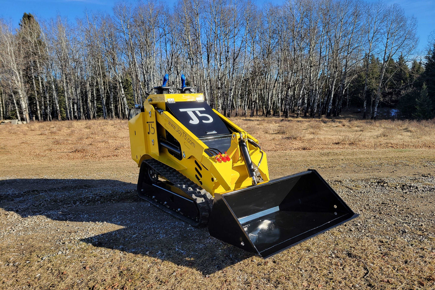 Diesel tracked mini skid steer 25 HP loader in Canada with front bucket attachment for compact construction landscaping and farming work

