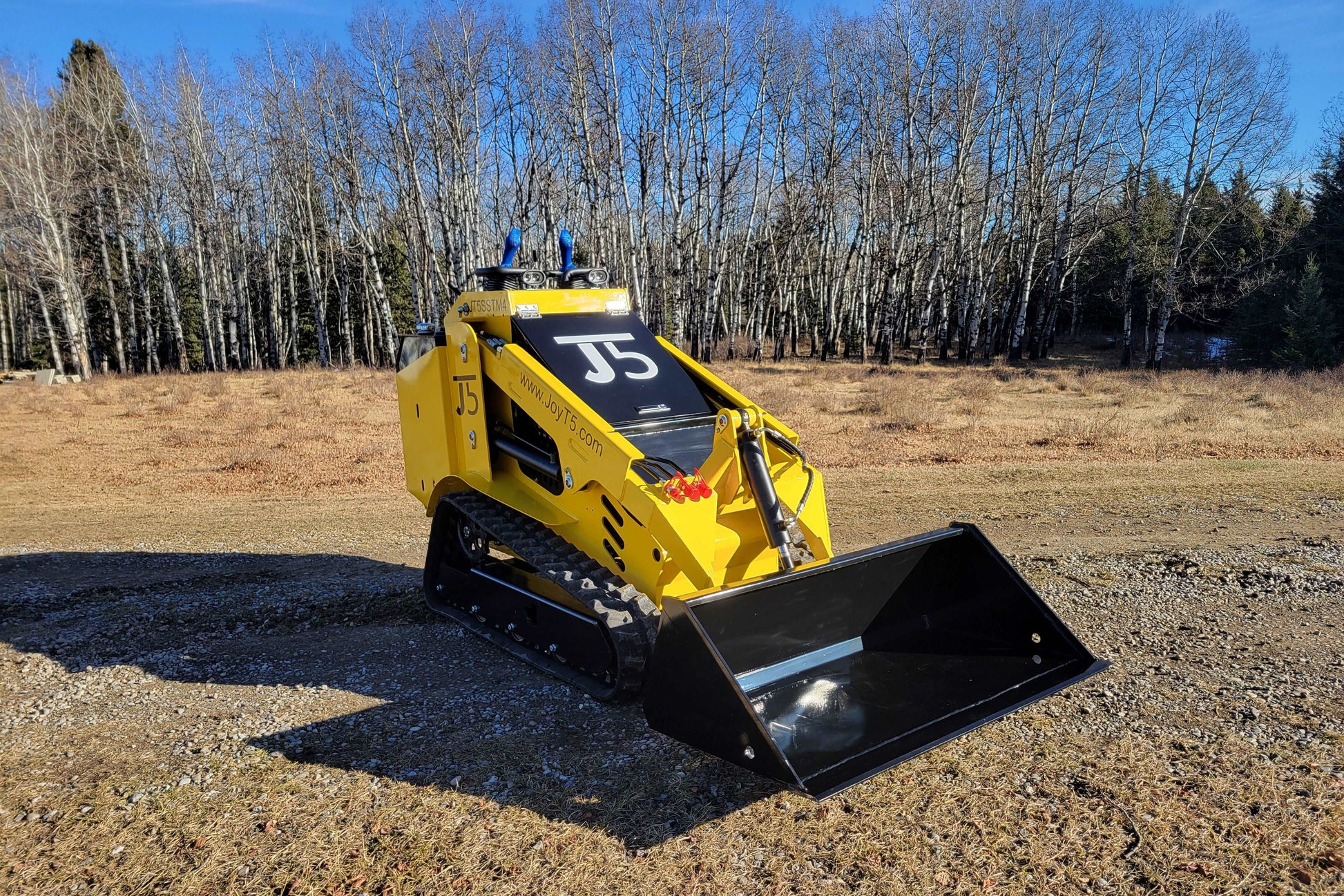 Diesel tracked mini skid steer 25 HP loader in Canada with front bucket attachment for compact construction landscaping and farming work

