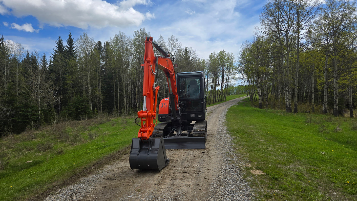 Front view of JT5600 6 ton mini excavator with Yanmar diesel engine and hydraulic blade for sale in Canada, compact excavator for construction and landscaping

