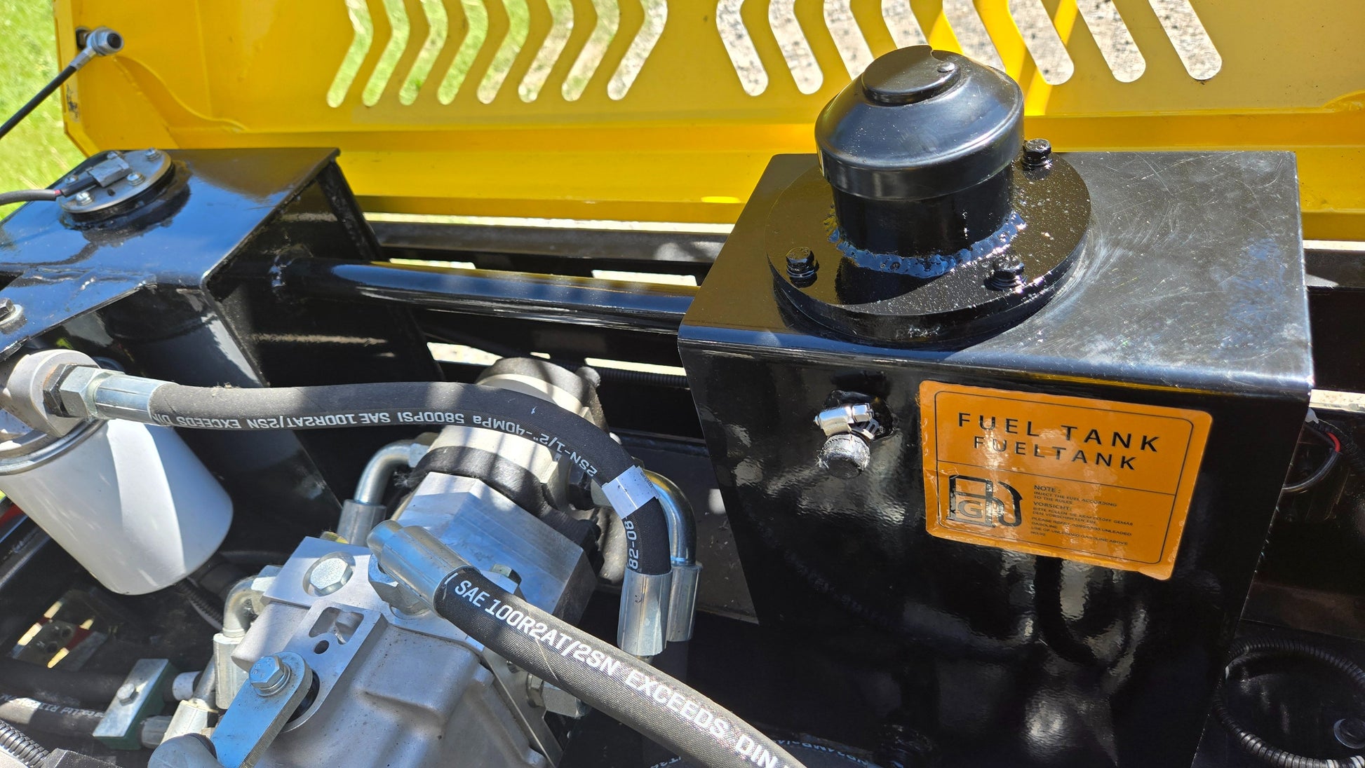 Fuel tank of JT5DR35 road roller with fuel label and connected hydraulic hoses by JoyT5 for sale in Calgary Alberta Canada