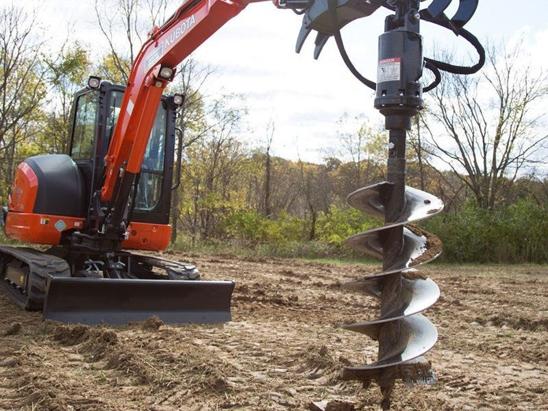 Hydraulic auger for excavators Canada and USA used on mini excavator drilling post holes in soil for construction and landscaping applications.

