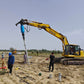 Komatsu PC270 excavator with J5-14000LS Hydraulic Anchor Drive Head installing screw piles | Heavy duty pile driver for solar and foundation construction