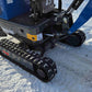Rippa R10 mini excavator parked on snow showing the rubber tracks undercarriage and blade in Canada from JoyT5