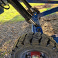 Close up view of JoyT5 heavy duty mobile loading ramp in Canada showing hydraulic lift system and solid tires for smooth movement and forklift use.