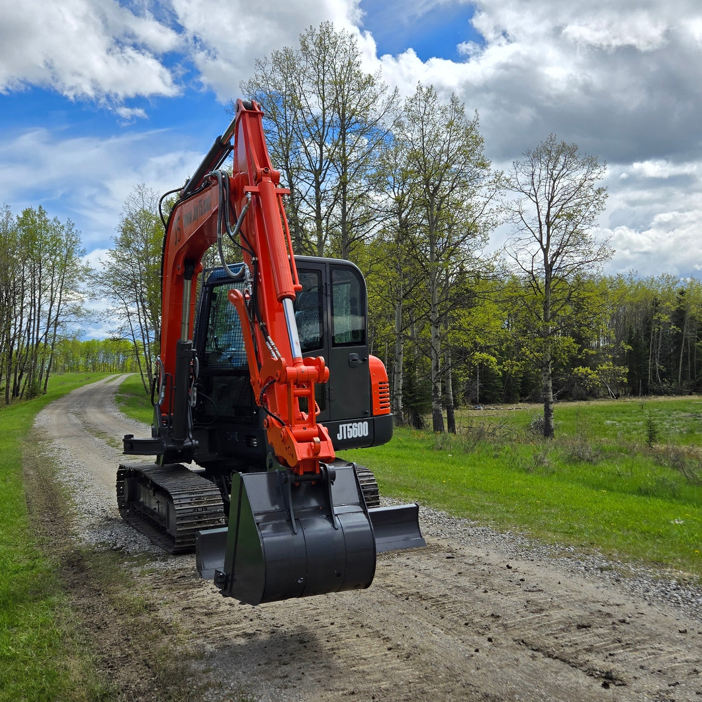 JoyT5 JT5600 6 ton mini excavator for sale in Canada with Yanmar diesel engine full cab and hydraulic thumb compact construction excavator working on site ideal for digging landscaping and heavy duty jobs in Canada and USA