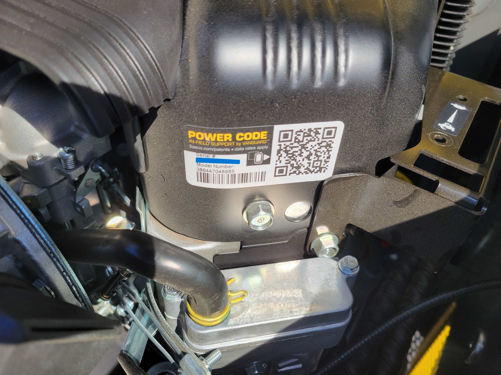 Close-up of Vanguard engine with Power Code label on JoyT5 JT5SSTM3 mini skid steer | reliable engine for compact tracked loader used in landscaping and construction