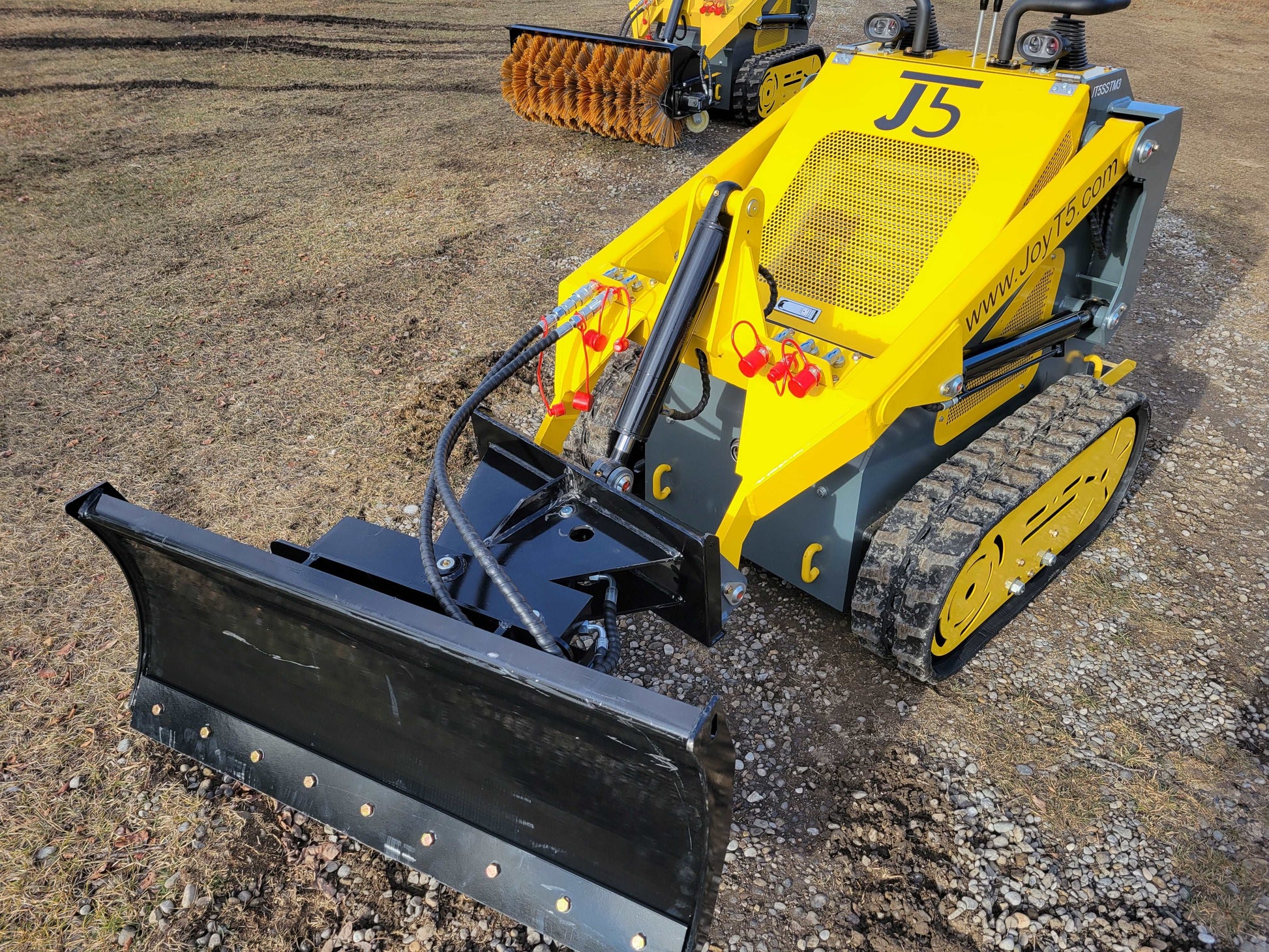 JoyT5 JT5SSTM3 mini skid steer with 220kg lifting capacity and blade attachment, compact tracked stand-on skid steer loader for landscaping and construction in Canada.
