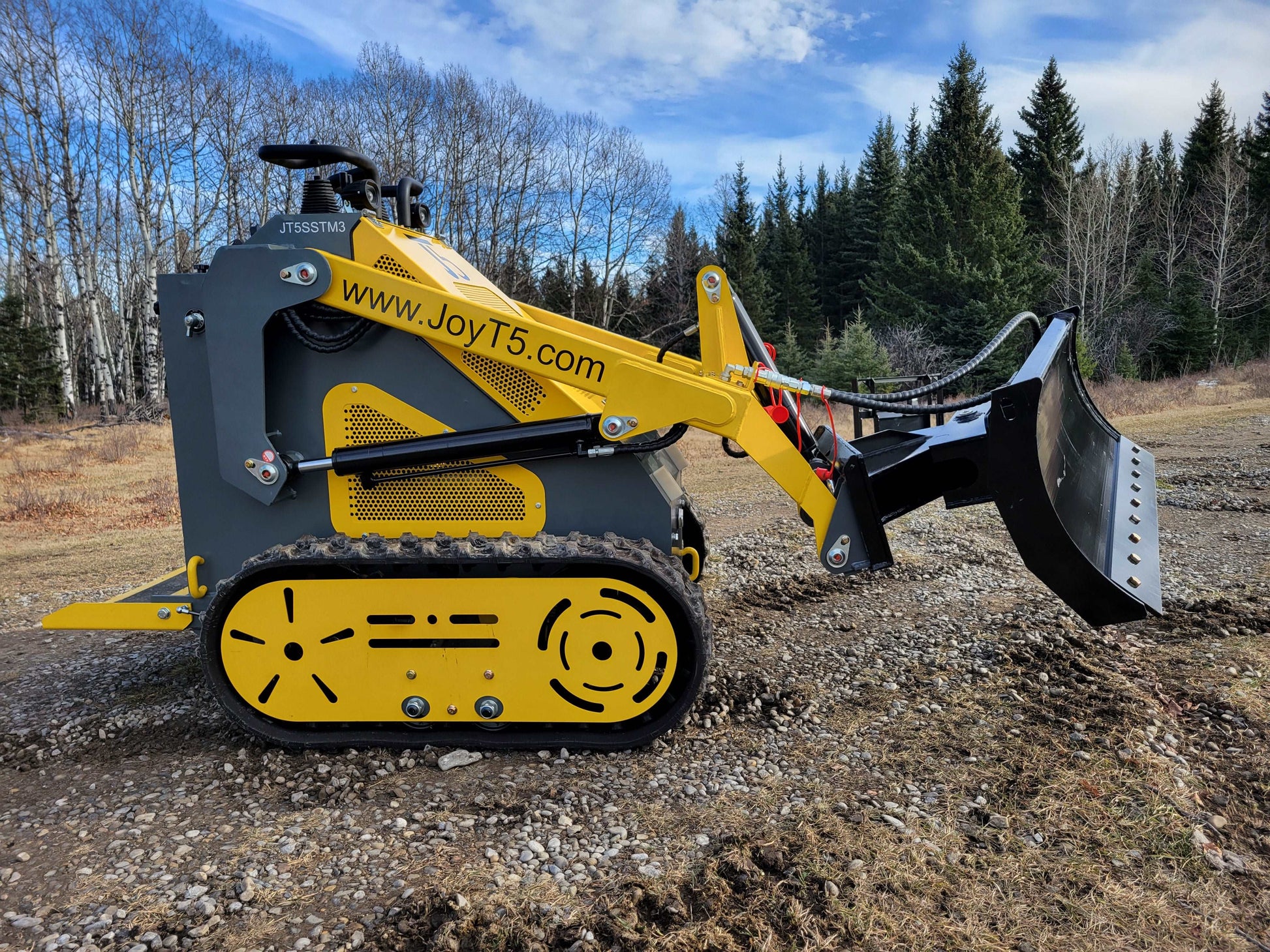 JoyT5 JT5SSTM3 mini tracked skid steer side view showing hydraulic bucket attachment for landscaping and construction work in Canada