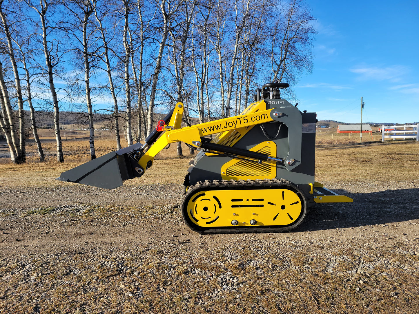 JoyT5 JT5SSTM3 tracked mini skid steer side view with 220kg lifting capacity. Compact stand-on skid steer loader for construction, landscaping, and tight spaces in Canada.