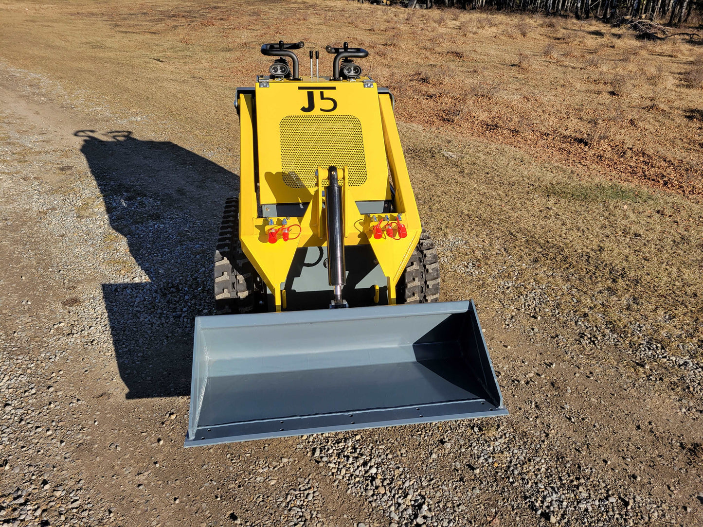 Front view of JoyT5 JT5SSTM3 tracked mini skid steer with 220kg lifting capacity | compact skid steer loader for tight space construction and landscaping in Canada