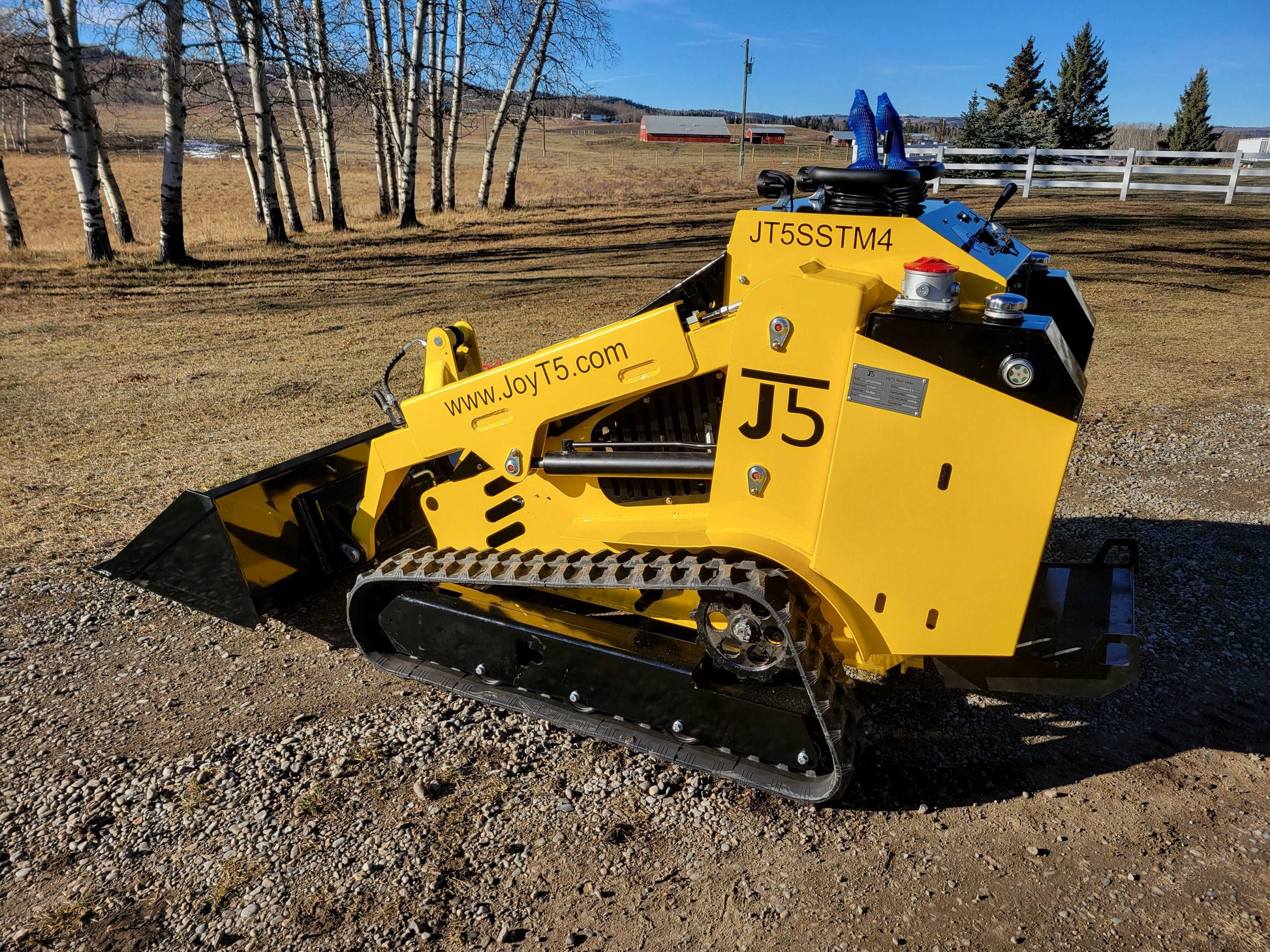 JoyT5 JT5SSTM4 tracked mini skid steer with low bucket position, compact diesel loader ideal for construction, landscaping, and farming.