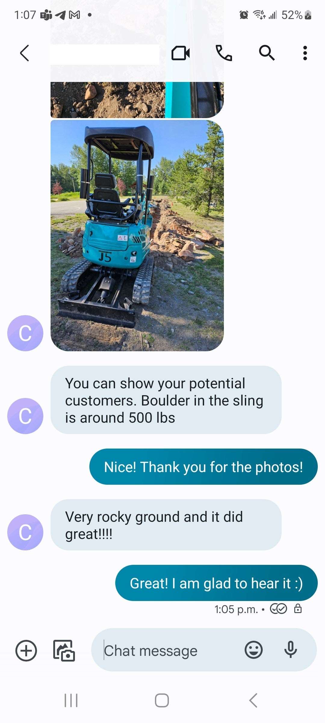 Customer review of JoyT5 mini excavator showing machine lifting 500 lb boulder on rocky ground during landscaping project in Calgary