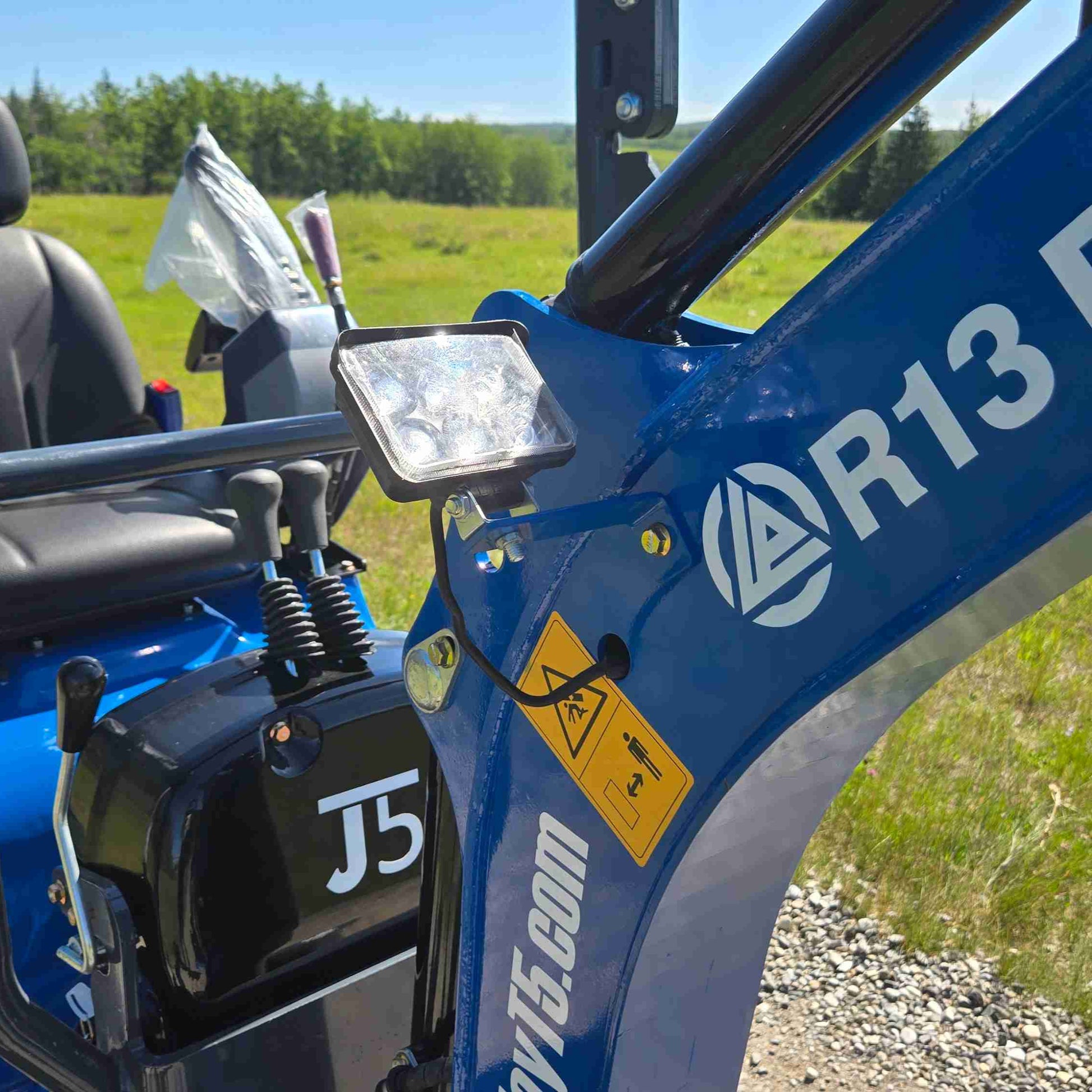 JoyT5 mini excavator R13 boom with integrated LED work light and reinforced arm design, built for safe and efficient compact digging operations across construction and landscaping projects in Canada