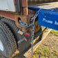 JoyT5 portable heavy duty steel loading ramp in Canada chained securely to truck trailer for safe forklift and container dock loading.


