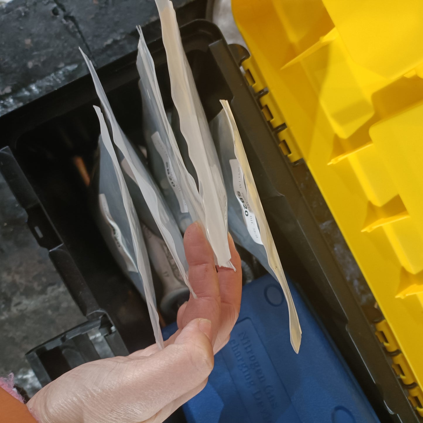 JoyT5 team organizing and packaging custom excavator attachment parts – quality control and preparation for shipment in Canada