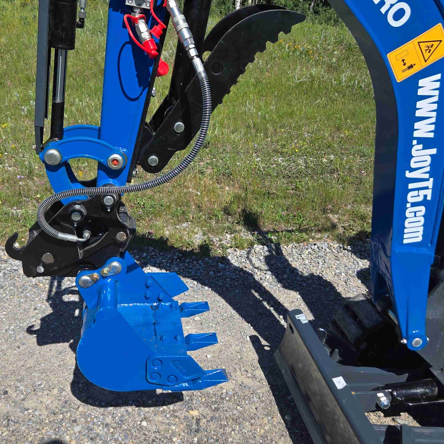 JoyT5 R13 mini excavator bucket with hydraulic thumb attachment for digging, trenching, and material handling on construction and landscaping projects in Canada