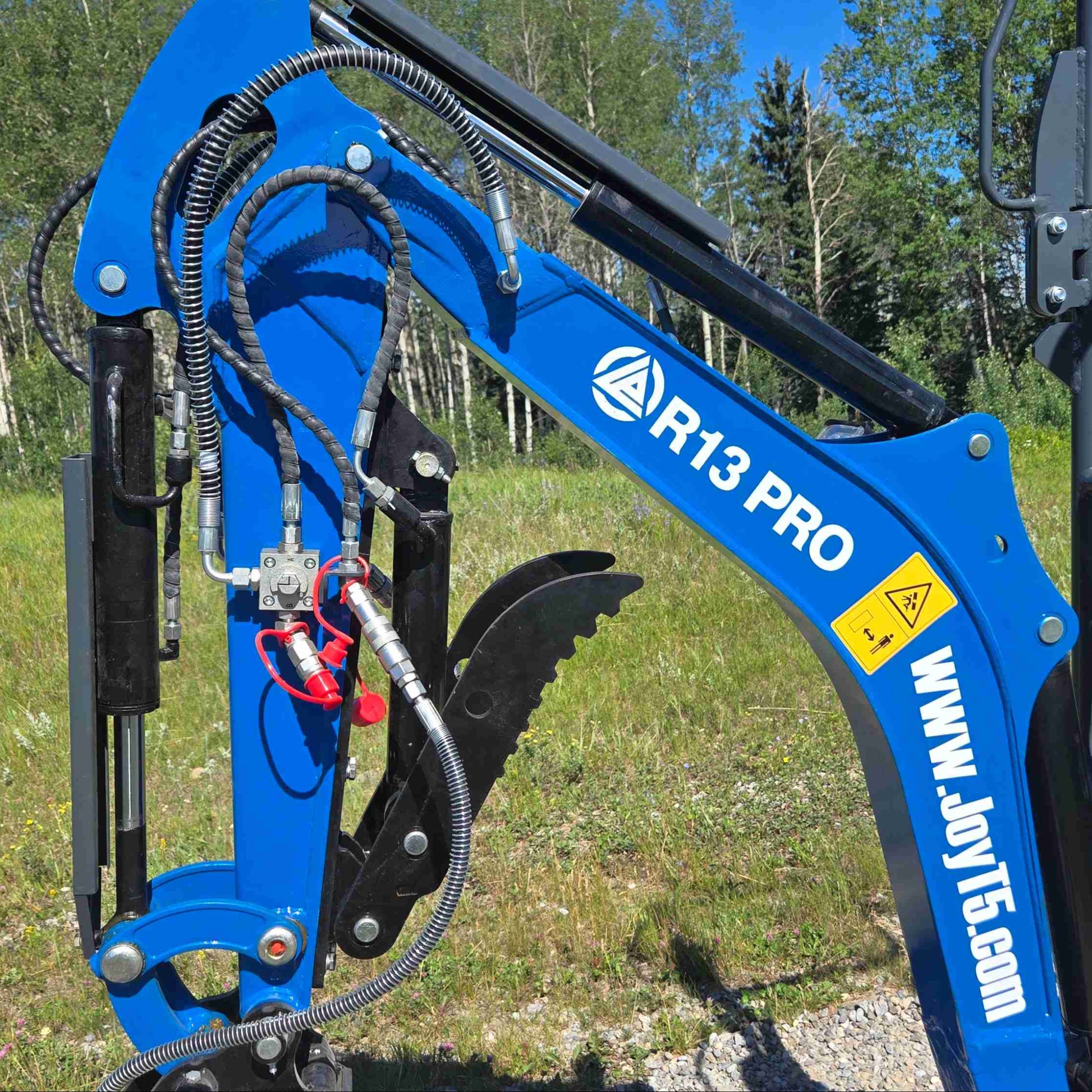 JoyT5 R13 mini excavator hydraulic arm with auxiliary hydraulic lines and thumb attachment for precise digging and material handling on construction sites in Canada