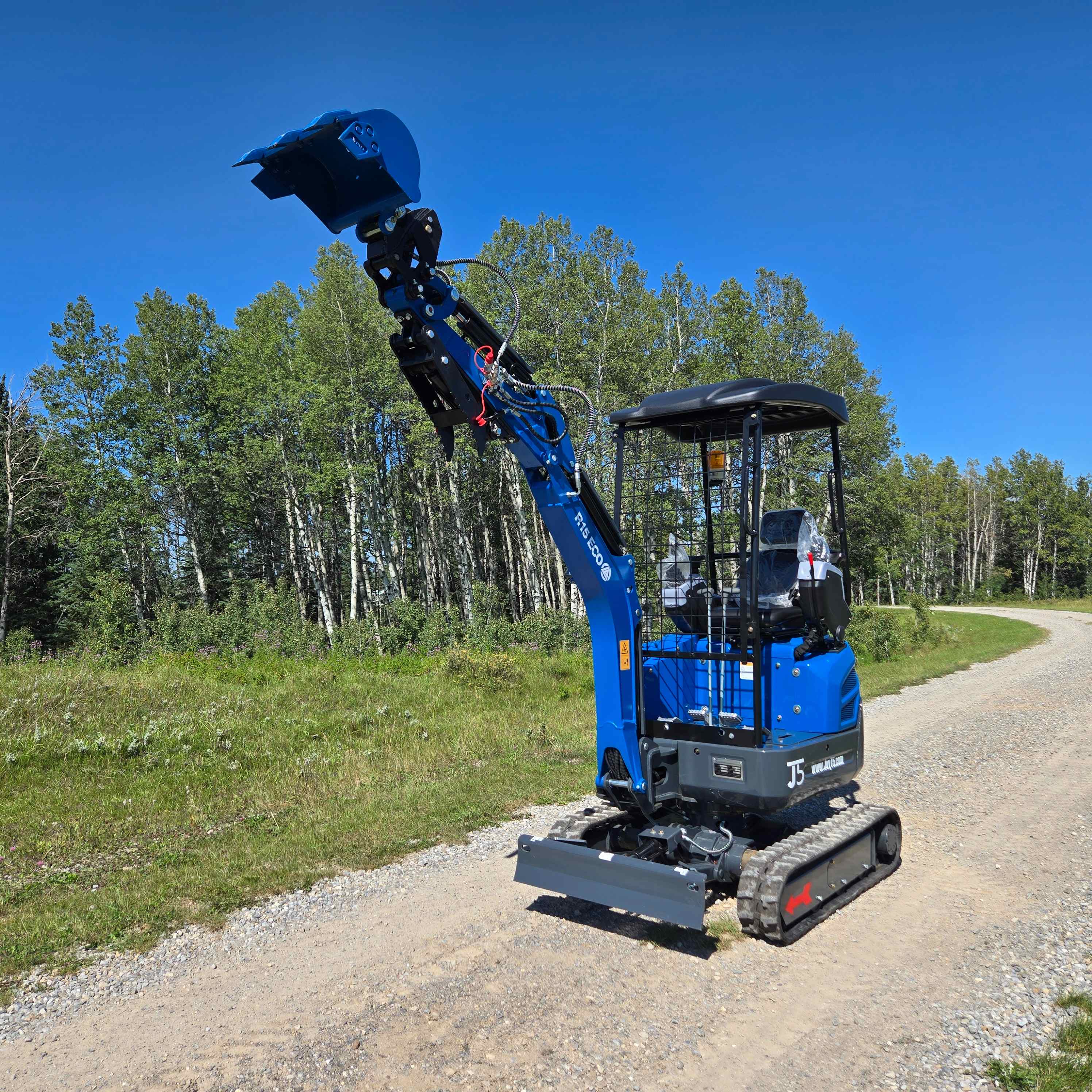 JoyT5 Rippa R15 1.5 ton mini excavator for sale in Canada compact digging machine with Kubota D722 engine showing raised boom position for landscaping construction work and residential excavation projects