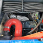 Close-up of JoyT5 Rippa R18 Mini Excavator engine with red air intake pipe, alternator and wiring