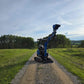 JoyT5 Rippa R18 Mini Excavator on gravel road with raised bucket outdoor working view