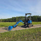 Side view of JoyT5 Rippa R18 Mini Excavator with digging bucket lowered to the ground on a gravel path