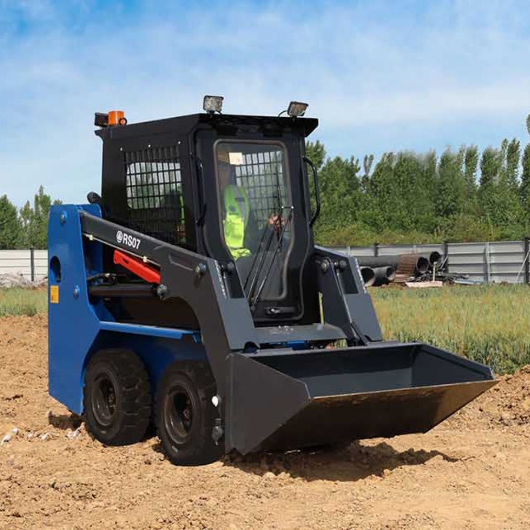 JoyT5 Rippa RS07 skid steer loader with front bucket working on a construction site for material handling and landscaping in Canada