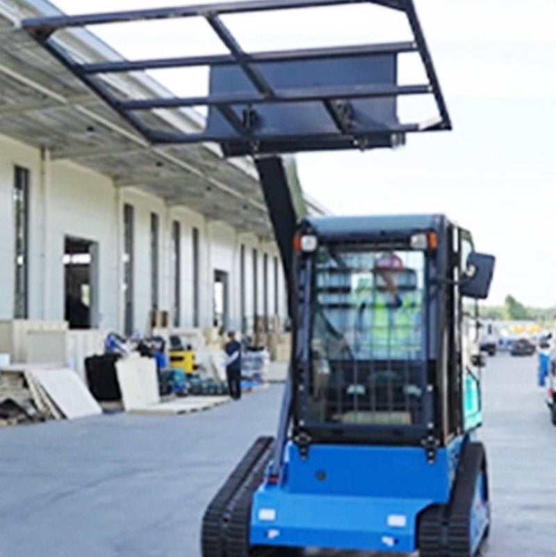 JoyT5 Rippa RS20 skid steer loader using fork attachment for material handling at a warehouse loading dock in Canada for industrial and construction operations