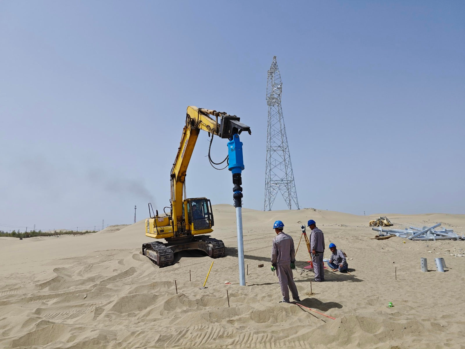 JT5 40000 anchor drive for sale in Canada high torque hydraulic helical pile drive operating on sandy site for foundation and ground anchor installation project



