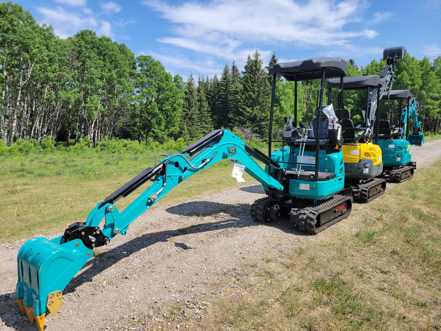 JoyT5 JT5200 2 ton mini excavator with Kubota D902 engine, compact zero-tail digger in lineup showing close-up of bucket, U-boom, side swing boom, and hydraulic thumb for construction and landscaping.
