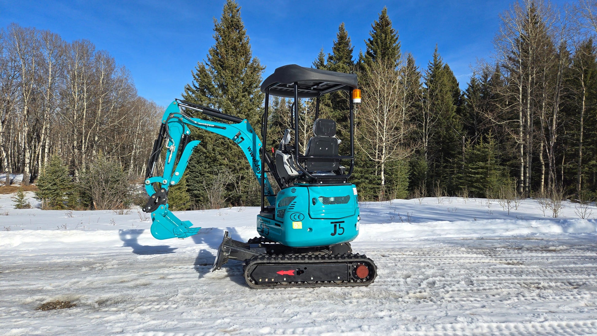 Left-side profile view of JoyT5 JT5200 2 ton mini excavator with digging arm raised. Compact and versatile machine for trenching, digging, landscaping, and construction projects.
