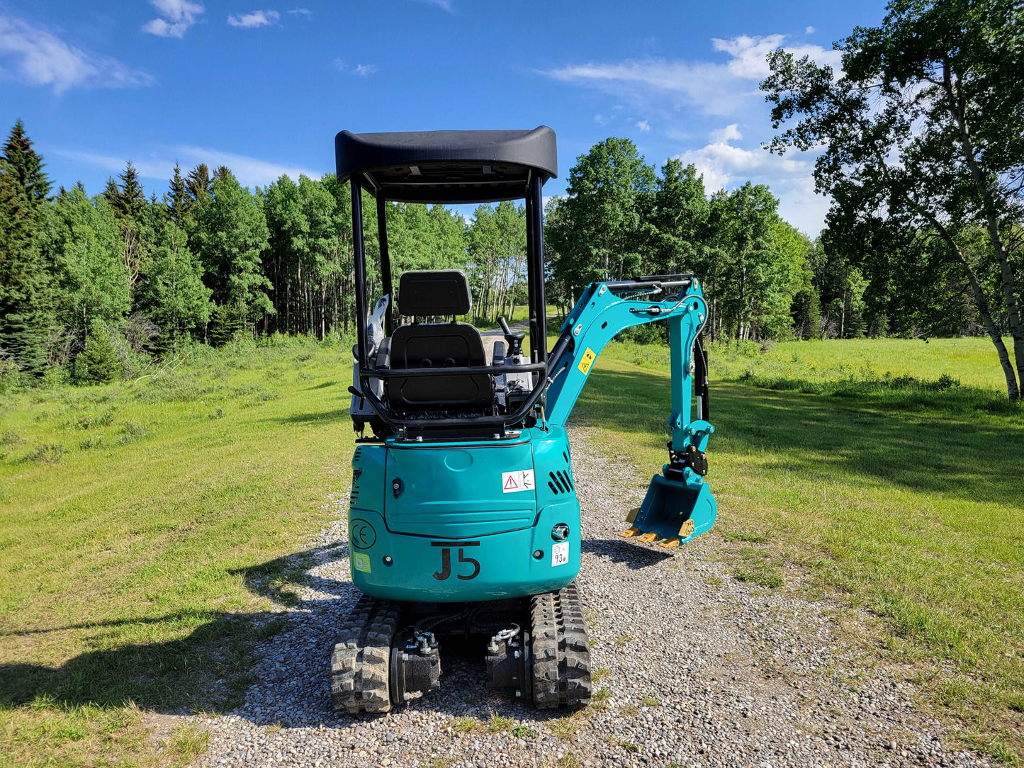 Rear view of JT5200 mini excavator showing operator seat, canopy, and compact design for efficient operation in tight spaces.
