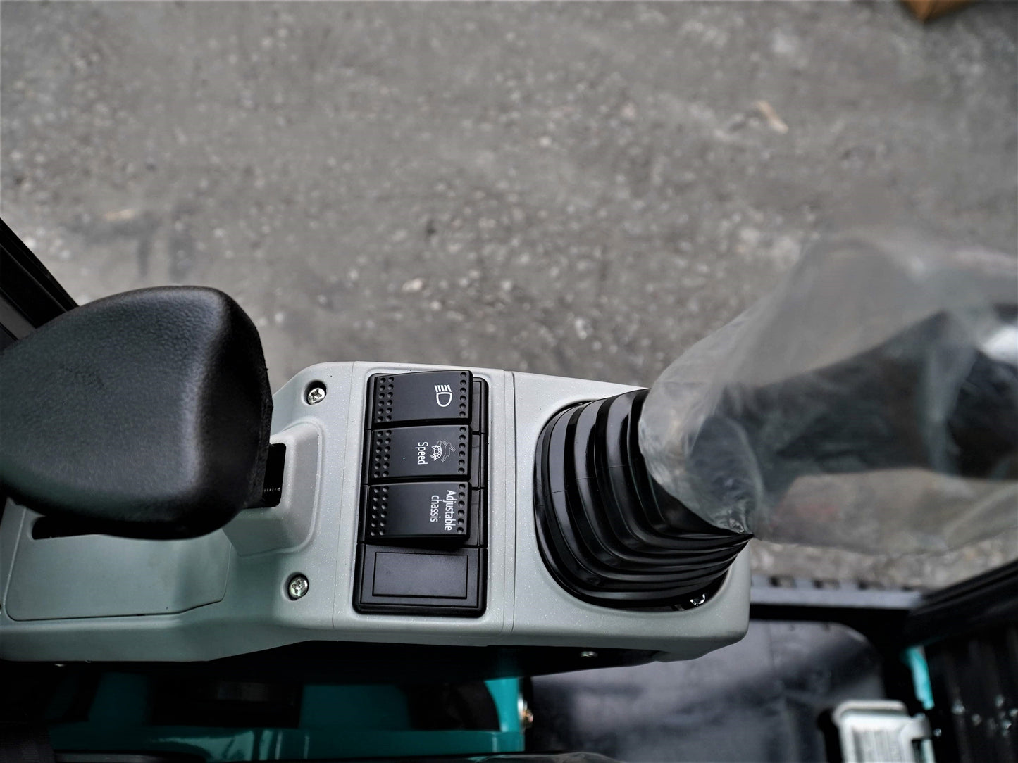 JT5200 2 Ton Mini Excavator joystick and operator control panel showing hydraulic functions, speed control, and work light switches for easy operation.