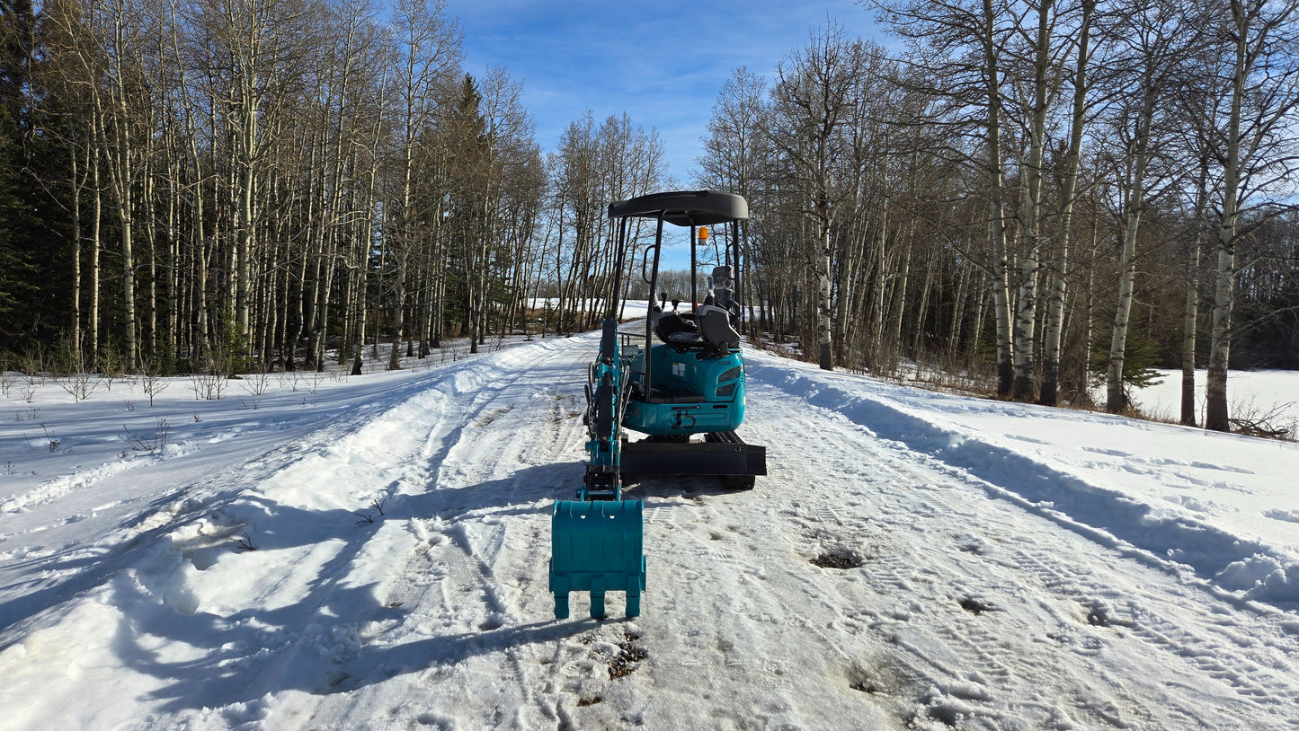 JT5200 2 ton mini excavator JoyT5 parked on snowy forest road in Canada showing straight rear bucket alignment and compact zero tail design while preparing for landscaping work