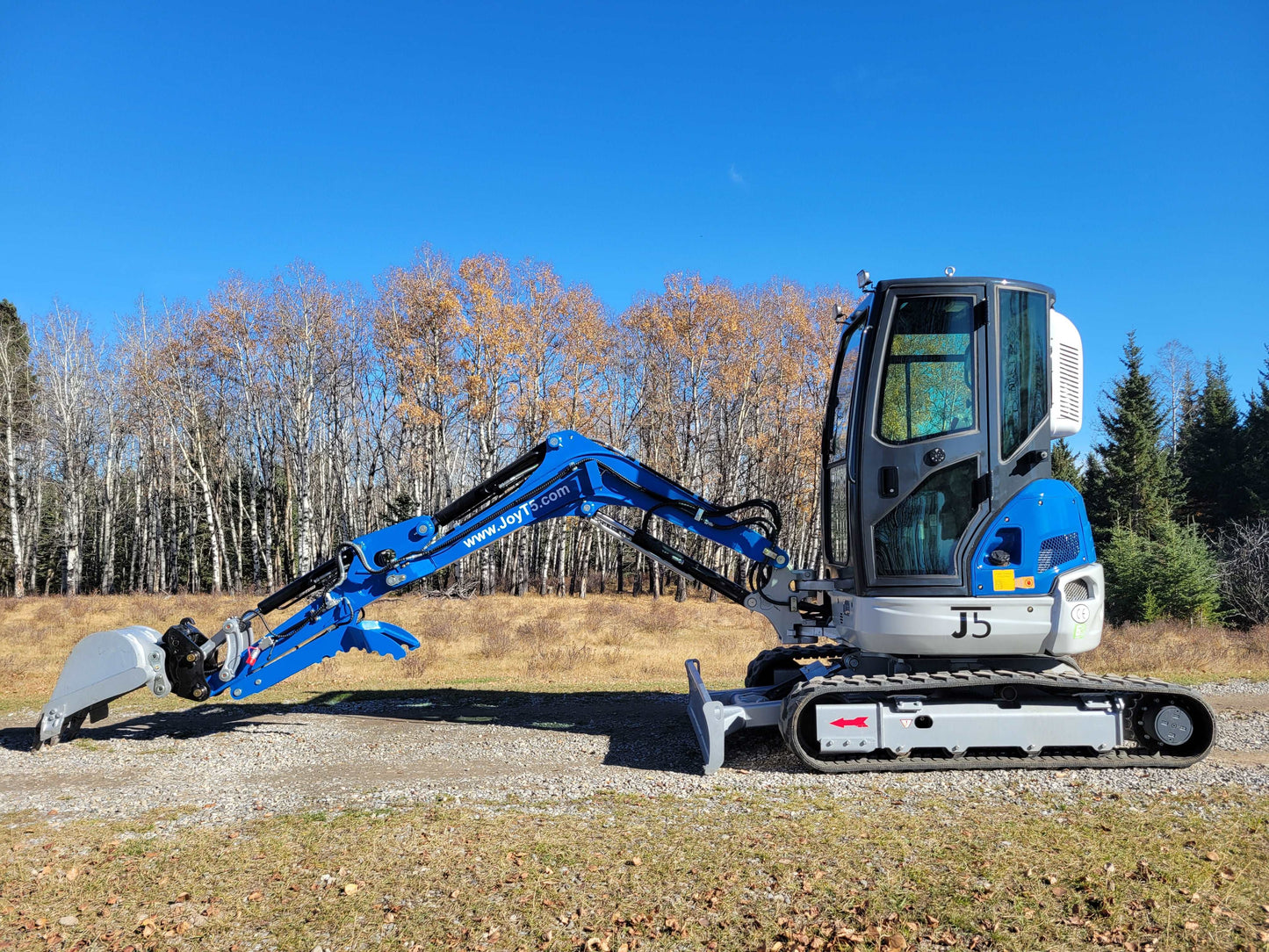 JT5350 3.5 ton mini excavator side view with zero tail swing on gravel site in Canada JoyT5 compact construction excavator with Kubota engine and hydraulic thumb