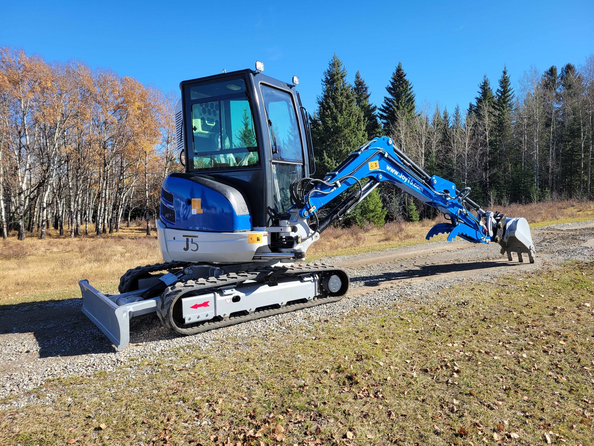 JT5350 3.5 ton mini excavator with Kubota engine hydraulic compact digger operating on gravel road in Canada ideal for small construction and landscaping projects
